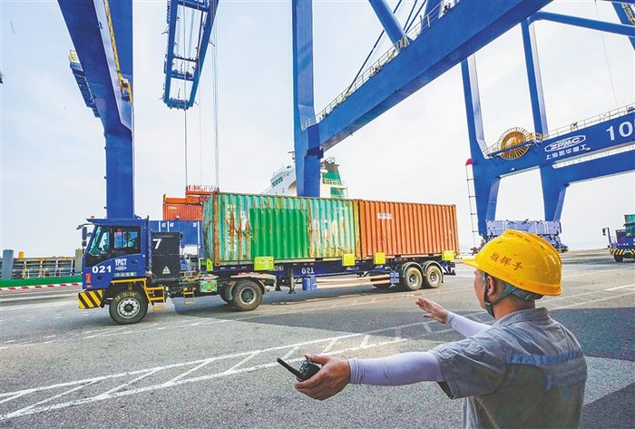 Signalman directing trucks at the terminal
